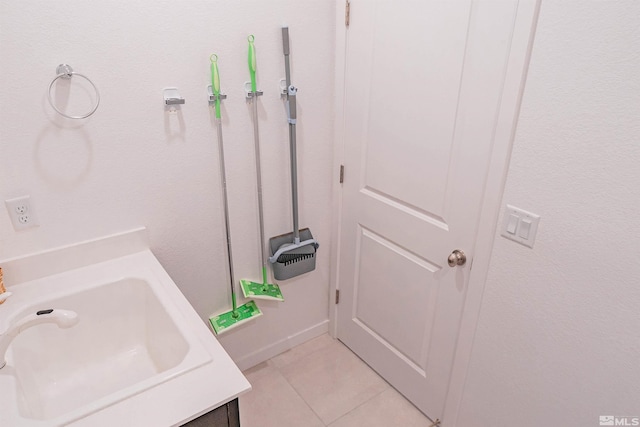 bathroom featuring tile patterned floors and sink