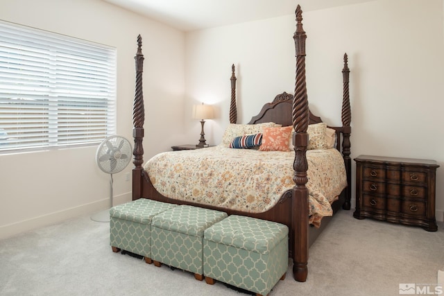 bedroom with light colored carpet