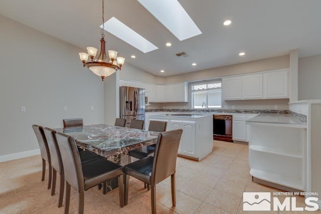 dining room featuring visible vents, recessed lighting, a skylight, light tile patterned floors, and baseboards