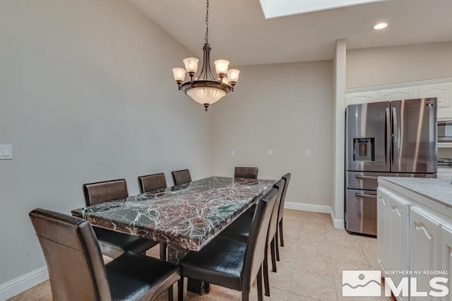 dining room featuring a chandelier, light tile patterned floors, recessed lighting, and baseboards