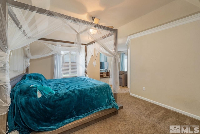 carpeted bedroom featuring ornamental molding