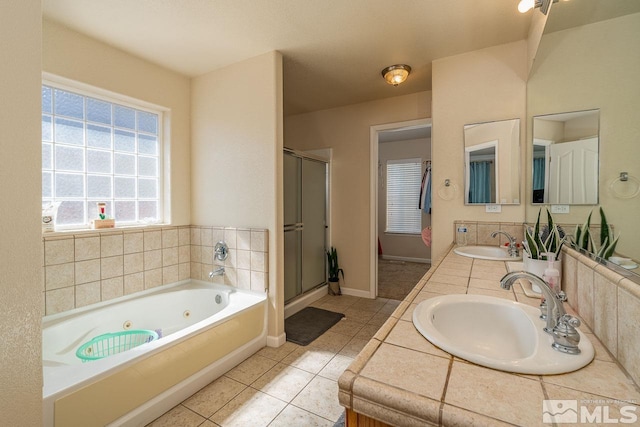 bathroom with tile patterned floors, vanity, and independent shower and bath