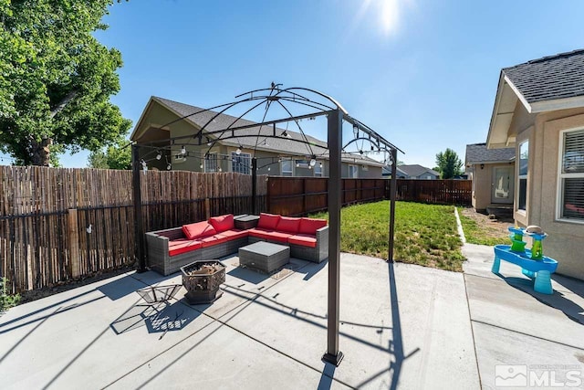 view of patio featuring an outdoor living space with a fire pit