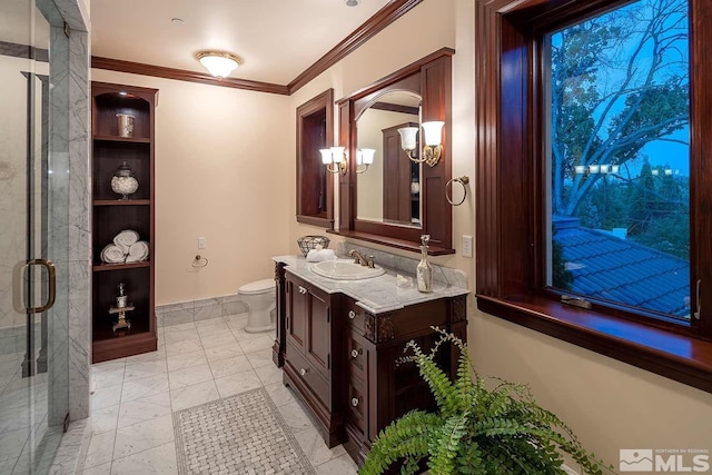 full bath featuring toilet, vanity, built in shelves, baseboards, and ornamental molding