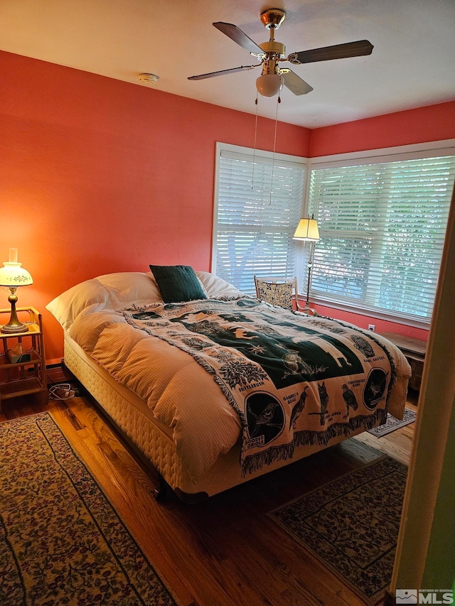 bedroom featuring ceiling fan and wood-type flooring