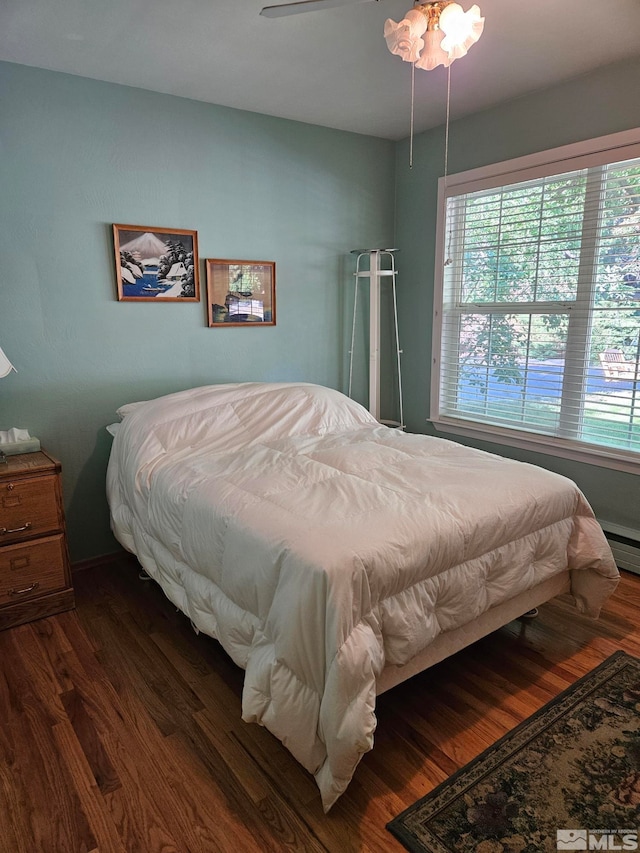 bedroom featuring dark hardwood / wood-style floors and ceiling fan