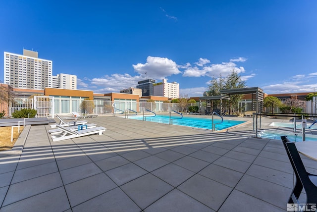 view of swimming pool with a patio