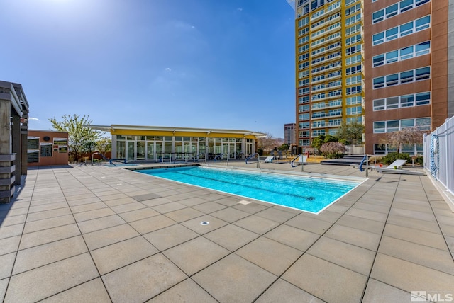 view of swimming pool featuring a patio area
