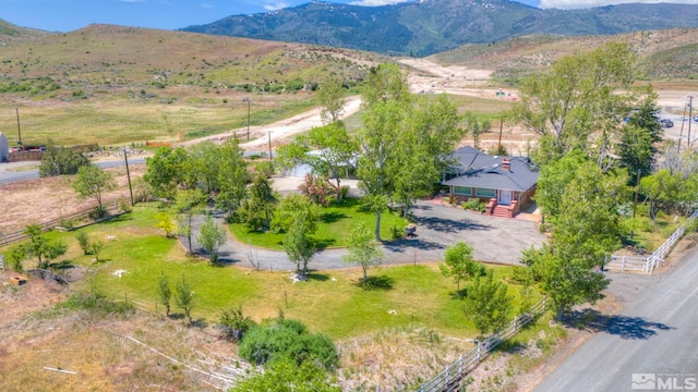 drone / aerial view featuring a rural view and a mountain view