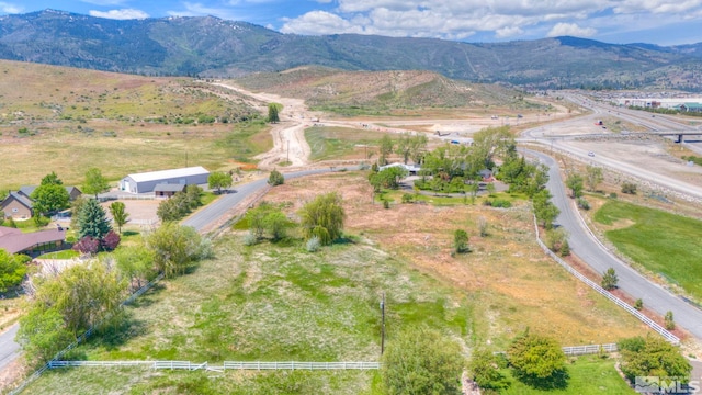 aerial view featuring a rural view and a mountain view