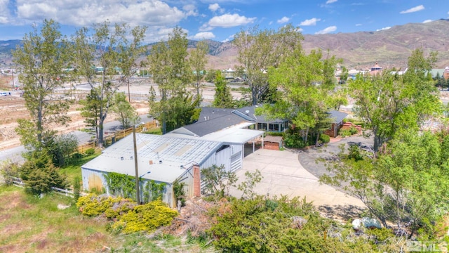 birds eye view of property featuring a mountain view