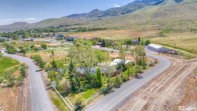 birds eye view of property with a rural view and a mountain view