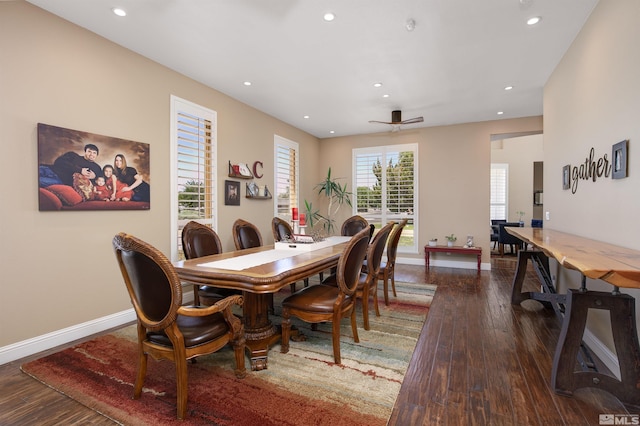 dining area with ceiling fan and dark wood-type flooring