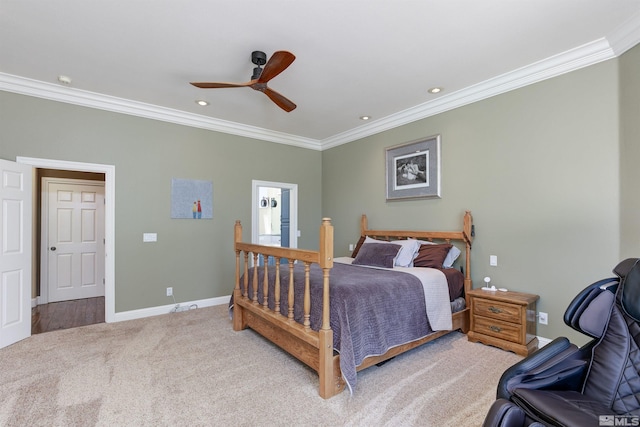 carpeted bedroom with ceiling fan and crown molding