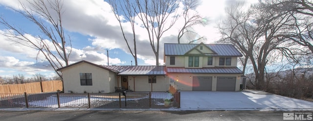 view of front of home with a garage