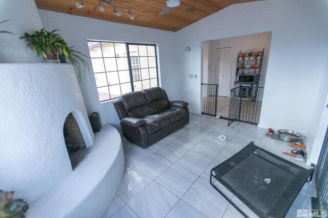 living room with wood ceiling, pool table, light tile patterned floors, ceiling fan, and lofted ceiling