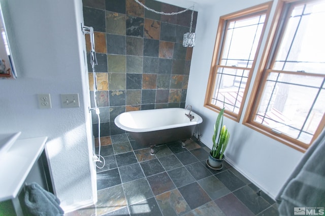 bathroom with a tub to relax in