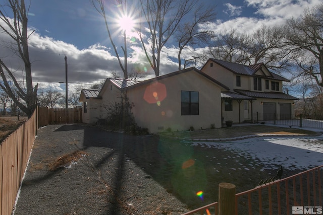 view of side of property with a garage