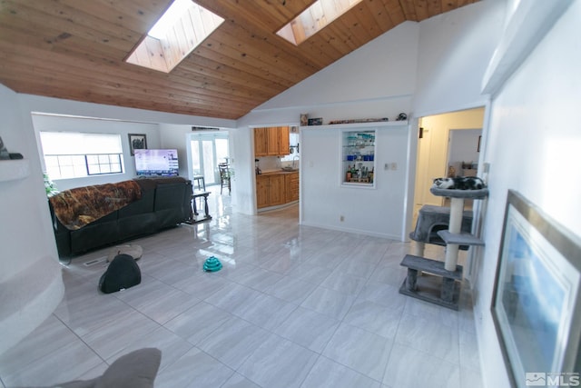 living room with high vaulted ceiling, a skylight, and wood ceiling