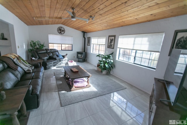 tiled living room featuring ceiling fan, wooden ceiling, lofted ceiling, and a wood stove