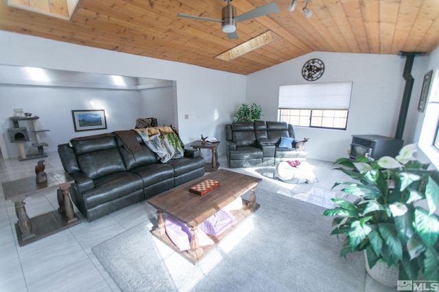 living room featuring ceiling fan, light tile patterned flooring, vaulted ceiling, and wood ceiling