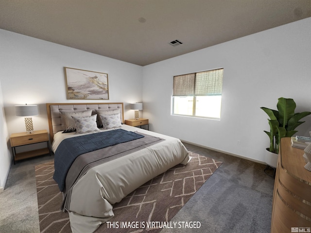 bedroom with dark colored carpet