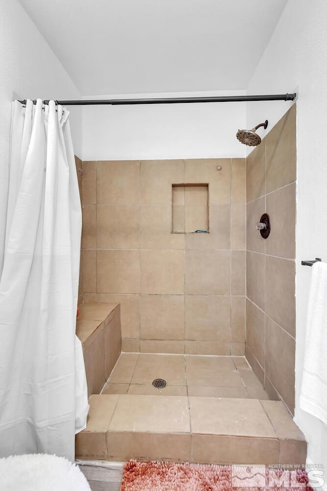 bathroom featuring curtained shower