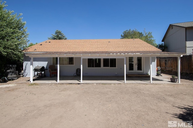 rear view of house featuring a patio area and french doors