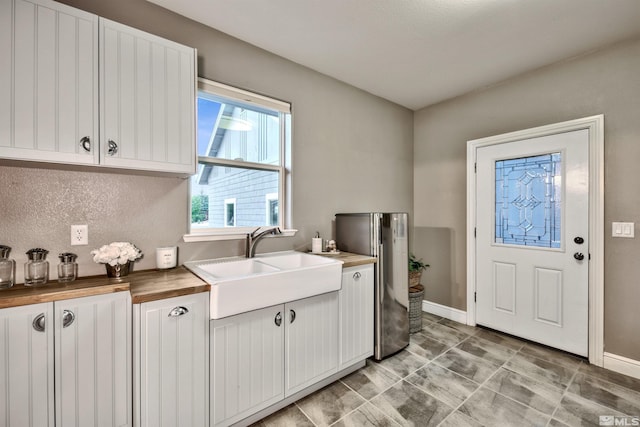 clothes washing area featuring sink