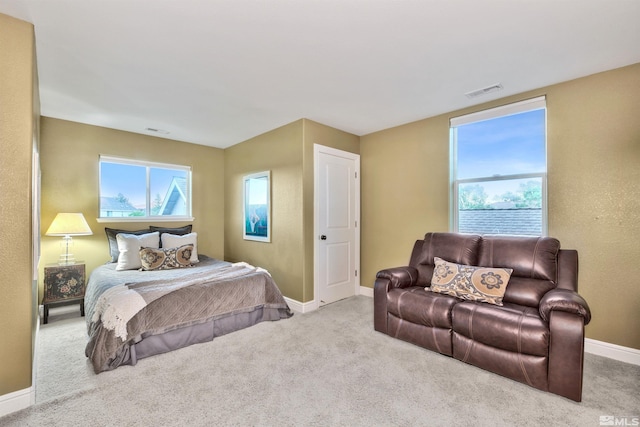 bedroom with light colored carpet