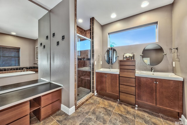 bathroom featuring vanity and an enclosed shower