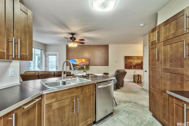 kitchen featuring stainless steel dishwasher, ceiling fan, light tile patterned floors, and sink