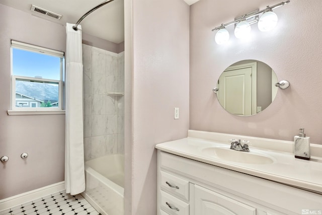 bathroom featuring vanity and shower / bathtub combination with curtain