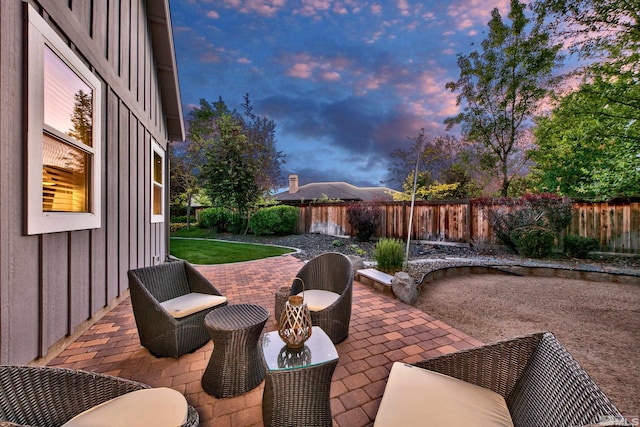 view of patio terrace at dusk