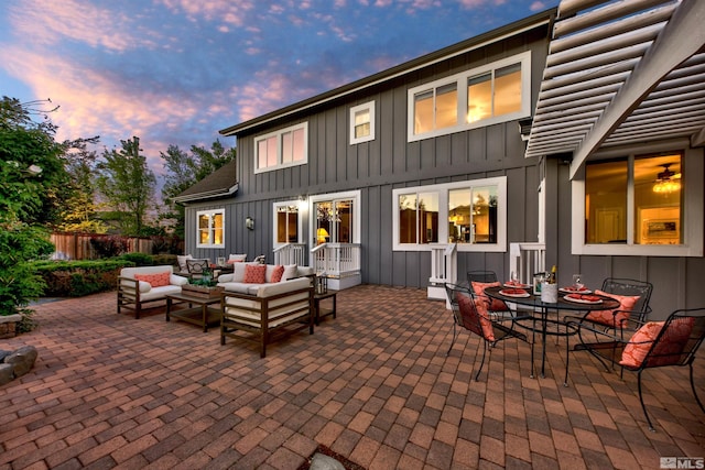 patio terrace at dusk with an outdoor hangout area