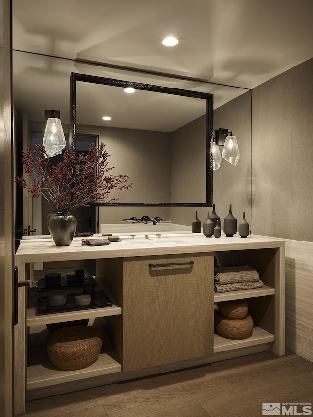 bathroom with vanity and hardwood / wood-style flooring