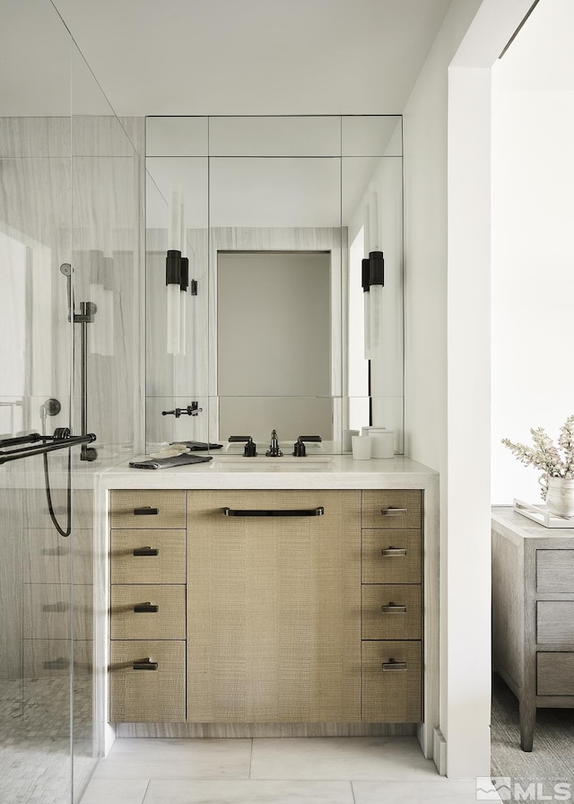 bathroom with vanity and walk in shower