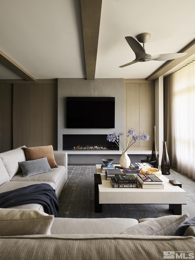 living room with beam ceiling and ceiling fan