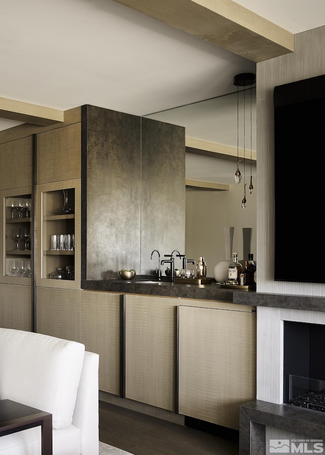 bar featuring decorative light fixtures and dark hardwood / wood-style floors