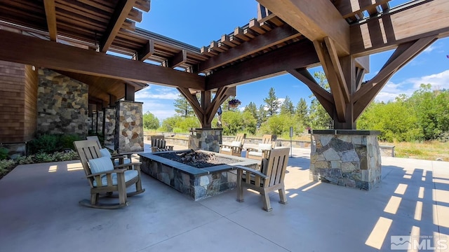 view of patio / terrace with an outdoor fire pit