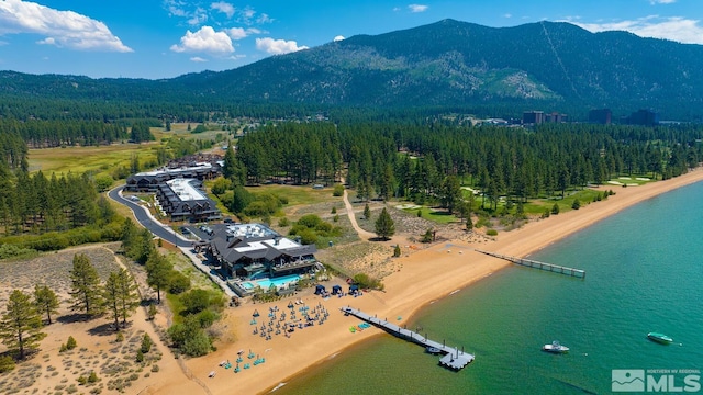 birds eye view of property featuring a water and mountain view