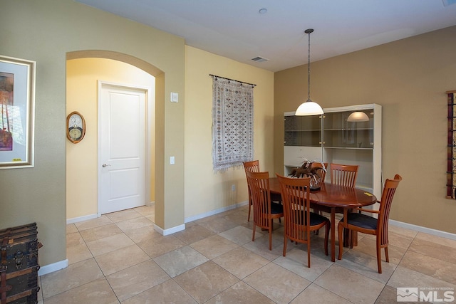 dining area featuring light tile patterned floors