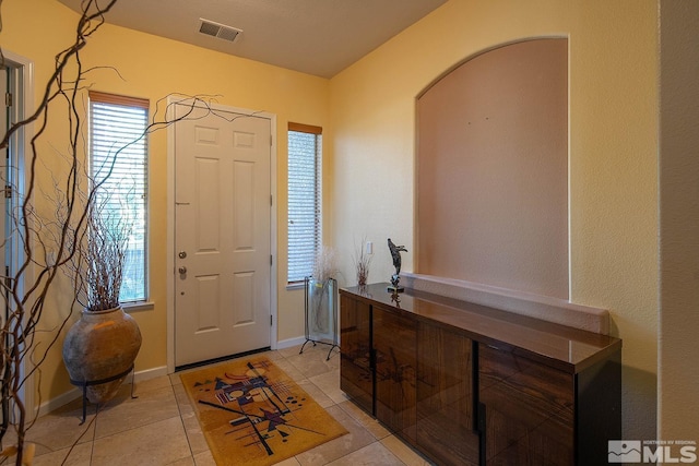 entrance foyer featuring light tile patterned flooring