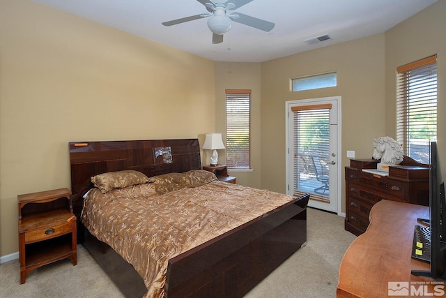 carpeted bedroom featuring access to exterior and ceiling fan