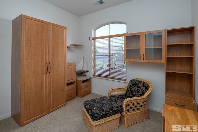 living area with light carpet