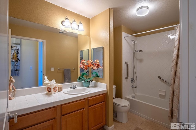 full bathroom with tile patterned floors, a textured ceiling, vanity, shower / bathtub combination with curtain, and toilet