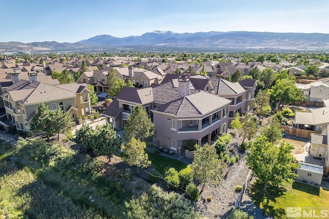 birds eye view of property featuring a mountain view