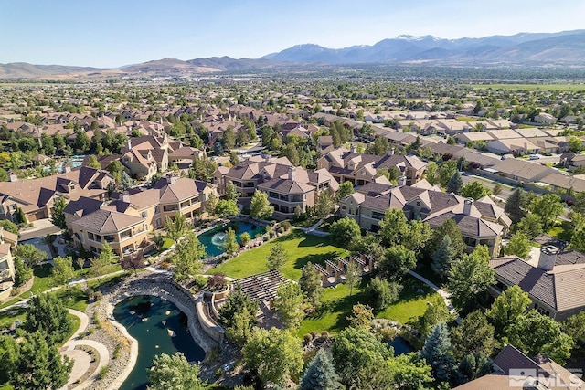 birds eye view of property featuring a mountain view