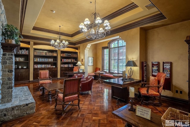 living area featuring dark parquet floors, ornamental molding, and a tray ceiling