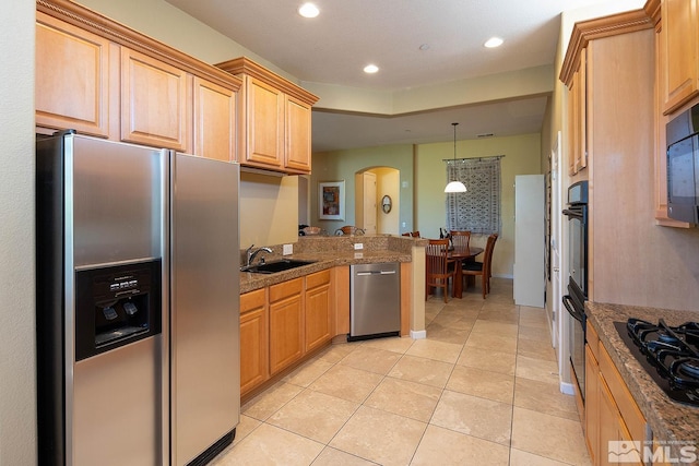 kitchen with sink, light brown cabinets, decorative light fixtures, light tile patterned floors, and black appliances